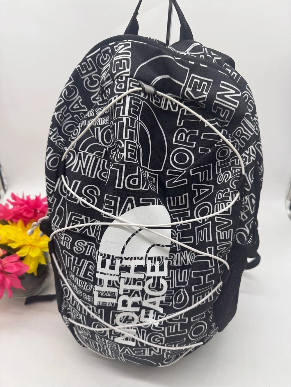 The North Face Black Backpack with White Logo Allover Print